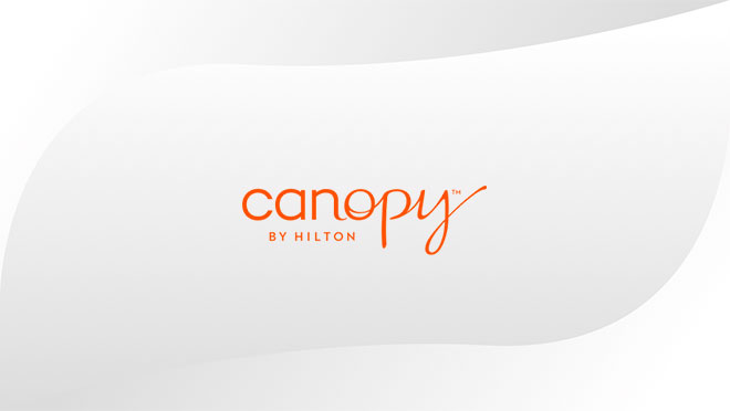 Canopy by Hilton logo displayed on hospitality TV